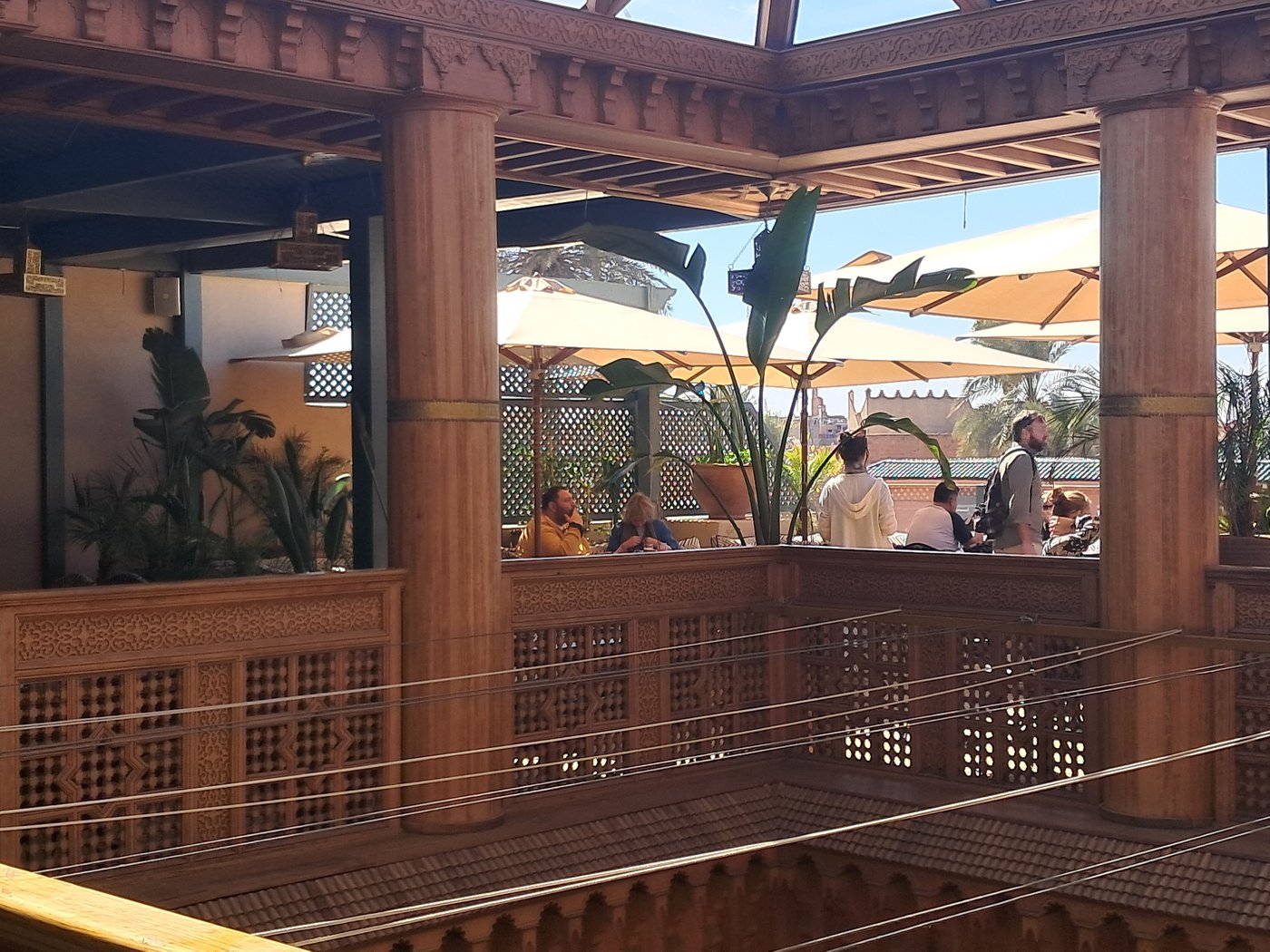 Looking down through the carved wooden galleries of the Moroccan Culinary Arts Museum to the rooftop